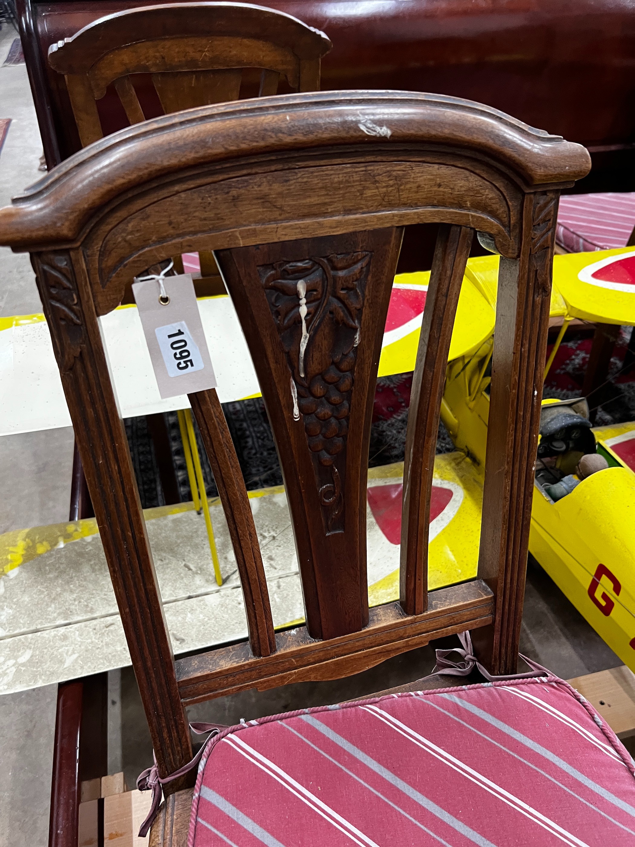 A set of four early 20th century French walnut dining chairs